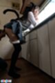 Bending over in kitchen skirt raised over her ass