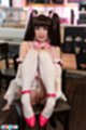 Ria kurumi seated drawing her knees up in stockings red high heels